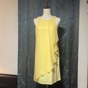 Light and sunny layered cocktail dress. Fully lined with flowing layers.